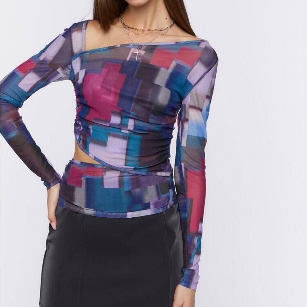 Sheer long sleeve cut out top. Mid drift